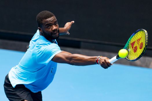 MELBOURNE, AUSTRALIA - JANUARY 13: Frances Tiafoe (USA) practices ahead of the 2023 Australian Open at Melbourne Park on January 13, 2023 in Melbourne, Australia.