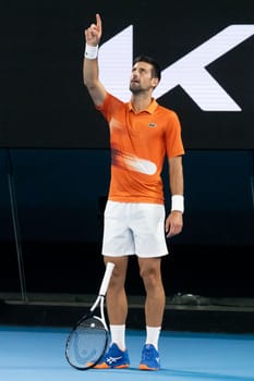 MELBOURNE, AUSTRALIA - JANUARY 13: Novak Djokovic of Serbia celebrates a point against Nick Kyrgios of Australia in an Arena Showdown charity match ahead of the 2023 Australian Open at Melbourne Park on January 13, 2023 in Melbourne, Australia.