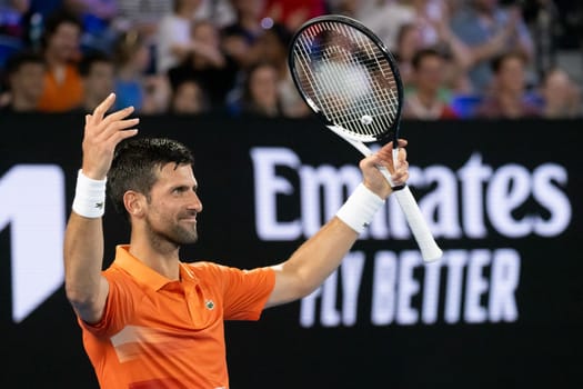 MELBOURNE, AUSTRALIA - JANUARY 13: Novak Djokovic of Serbia celebrates a point against Nick Kyrgios of Australia in an Arena Showdown charity match ahead of the 2023 Australian Open at Melbourne Park on January 13, 2023 in Melbourne, Australia.