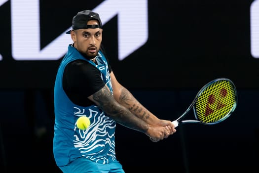MELBOURNE, AUSTRALIA - JANUARY 13: Nick Kyrgios of Australia plays against Novak Djokovic of Serbia in an Arena Showdown charity match ahead of the 2023 Australian Open at Melbourne Park on January 13, 2023 in Melbourne, Australia.