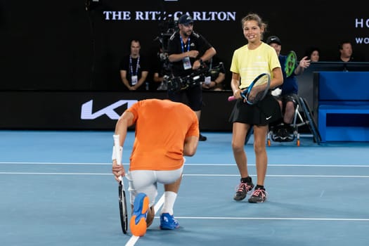 MELBOURNE, AUSTRALIA - JANUARY 13: Novak Djokovic and Ana Maric celebrate a point against Nick Kyrgios and Thaadhie Karunanayake in an Arena Showdown charity match ahead of the 2023 Australian Open at Melbourne Park on January 13, 2023 in Melbourne, Australia.