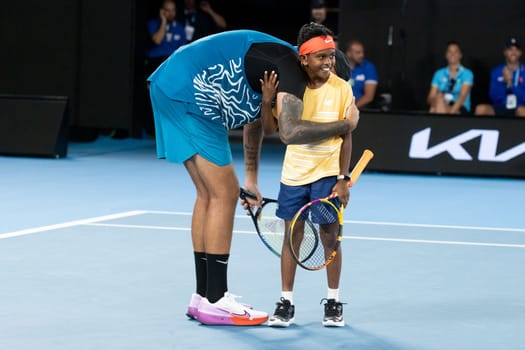 MELBOURNE, AUSTRALIA - JANUARY 13: Nick Kyrgios of Australia and Thaadhie Karunanayake celebrate a point against Novak Djokovic and Ana Maric whilst playing an Arena Showdown charity match ahead of the 2023 Australian Open at Melbourne Park on January 13, 2023 in Melbourne, Australia.