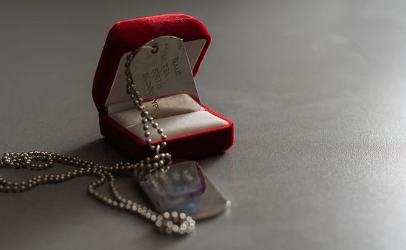 American military dog tags in a wedding ring box.