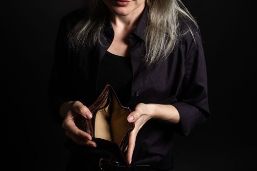 woman holding an empty wallet.