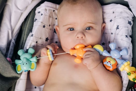 Close-up of the face of a cute baby lying in.