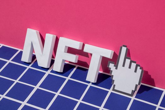 NFT letters symbol 3D text and pixel mouse cursor finger pointer. Minimal concept of blockchain and cryptocurrency online. High quality photo