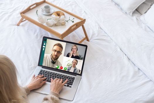 Virtual meeting online. Video conference by laptop. Online business meeting. On the laptop screen, people who gathered in a video conference to work on-line.