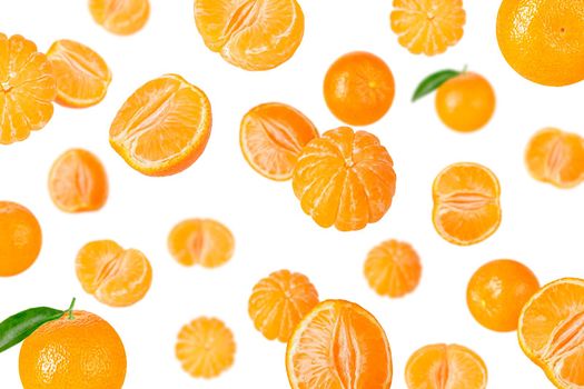 Creative levitation pattern with whole and pieces peeled tangerines. Selective focus. Isolated fruit. Packaging concept. Clip art image for package design.