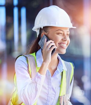 Construction worker, woman with smartphone for phone call and communication with technology and helmet for safety. Happy with construction, building industry and mobile phone, contact with lens flare.