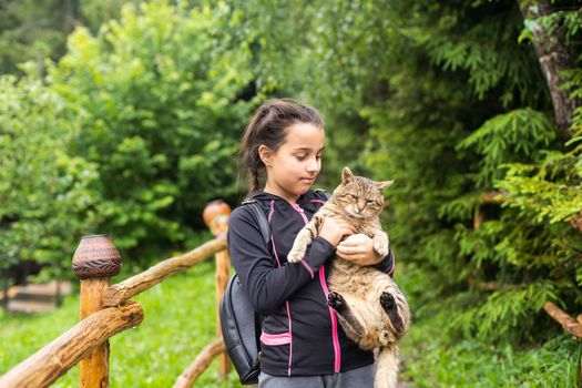 portrait of a little girl with a cat