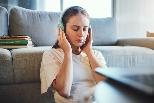 Student, stuyding and headphones for relax, mental health and wellness music for higher education. Girl, university student and break from studies for education and knowledge and comfort.
