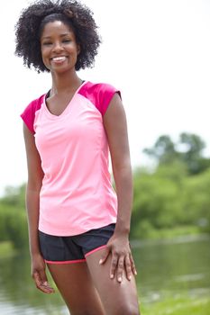 Exercising outdoors makes me happy. Cropped portrait of a female athlete smiling widely and standing outdoors in a casual stance