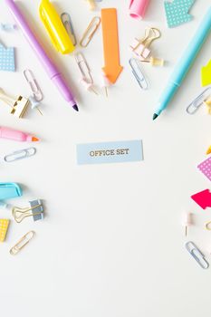 Stationery, school supplies on a white table in bright pastel colors. Inscription