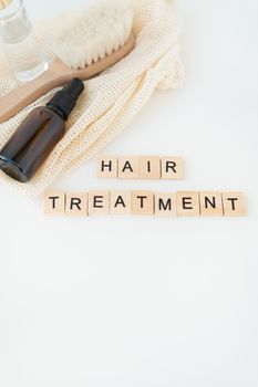 Hair loss in comb, daily serious hair loss problem. Hair treatment wooden lettering