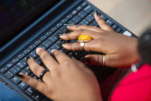 female hands on laptop keyboards.