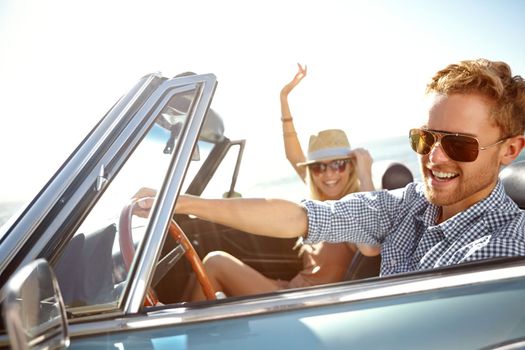 Car road trip, happy travel and couple on bonding holiday adventure, transportation journey or fun summer vacation. Love flare, convertible automobile and driver driving on Canada countryside tour.
