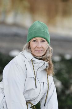 Portrait of a fifty-year-old woman with a white smile