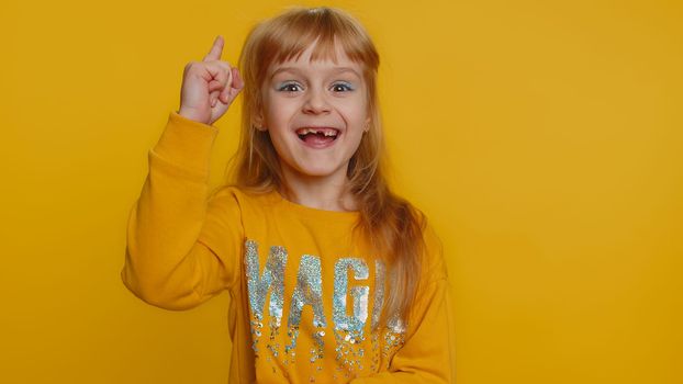 Eureka. Inspired young preteen child girl kid pointing finger up with open mouth, having good idea, plan, startup, showing inspiration motivation gesture, problem solution. Little toddler children