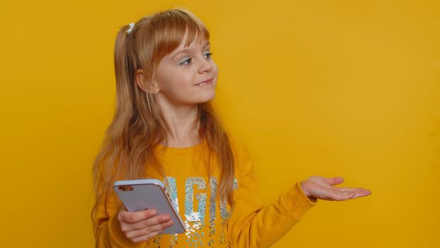Young preteen child girl kid using smartphone typing new post on web, browsing, searching, addiction of social networks, show thumbs up like, positive feedback, recommends wifi cellular connection 5G