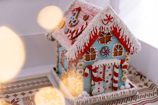 The hand-made eatable gingerbread house and snow decoration.