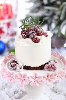 Mousse cakes with coconut cream and Greek yogurt over chocolate cake are the perfect dessert. Add whipped cream and berries. Treat friends and loved ones on Christmas or New Year's Eve