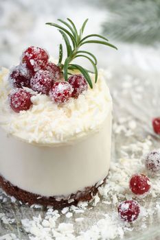Mousse cakes with coconut cream and Greek yogurt over chocolate cake are the perfect dessert. Add whipped cream and berries. Treat friends and loved ones on Christmas or New Year's Eve