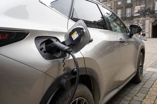 Copenhagen, Denmark. October 2022. an electric car being recharged in the city center