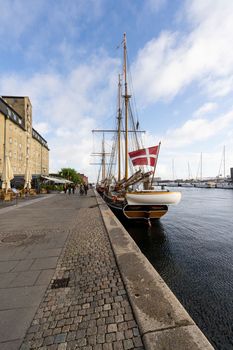 Copenhagen, Denmark. October 2022.  an old wooden vessel moored on the quay in the city center