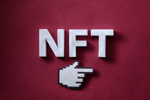 NFT token on the blockchain in the digital online space and pixel mouse finger pointer concept of modern technologies and innovations. High quality photo