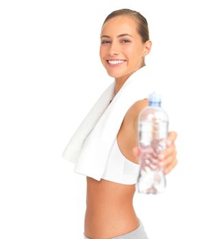 Fitness woman giving water bottle in studio for health, wellness and training motivation or offer. Liquid. nutrition and sports athlete mockup with hand holding product isolated on white background.