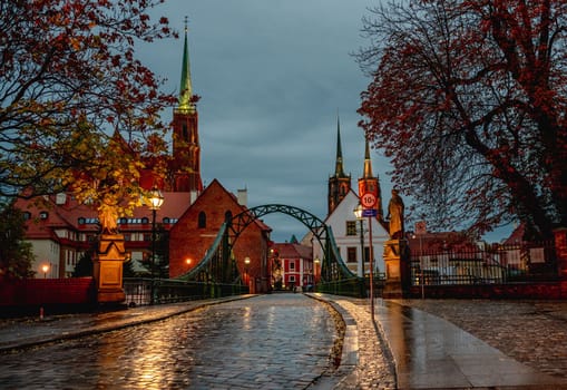 Bridge to Tumski island at night in Wroclaw, Poland