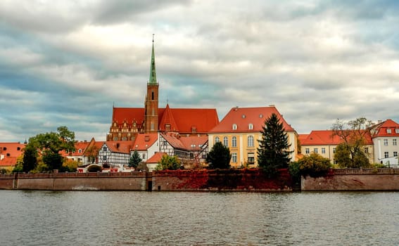 Wroclaw Poland view at Tumski island and Cathedral of St John the Baptist with bridge through river Odra. Picturesque landscape autumn