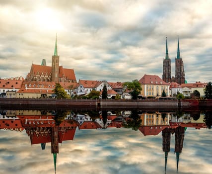 Wroclaw Poland view at Tumski island and Cathedral of St John the Baptist with bridge through river Odra. Picturesque landscape autumn