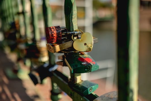 Padlocks hanging on Tumski bridge in Wroclaw, Poland