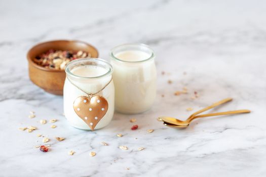 Valentine Day breakfast of yogurt and oat flakes, side view