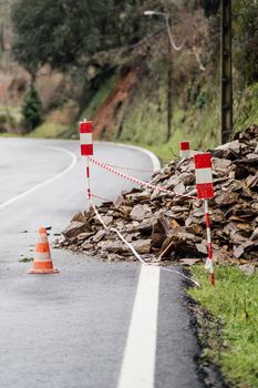 Rocks blocking the road due to a rockslide after a heavy rainfall