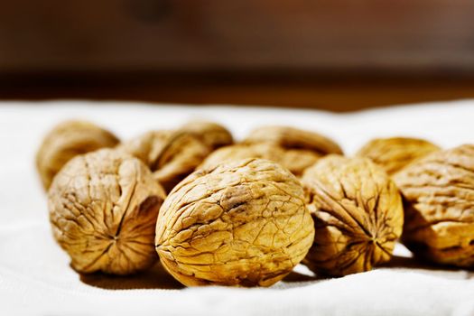 Whole walnuts on white cloth  , healthy eating