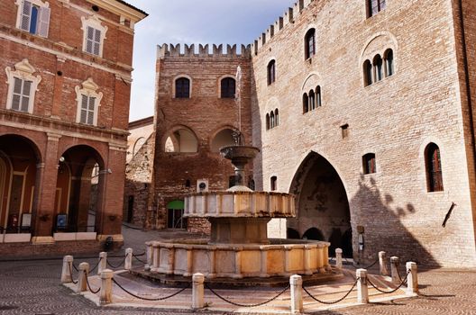 Fabriano ,Italy , Piazza del comune with  Sturinalto Fountain built in 1285 and gothic Palazzo del Podestà with swallow-tail battlements
