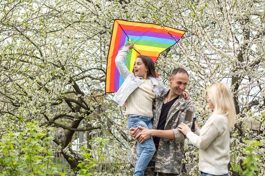 Family Welcoming Husband Home On Army Leave