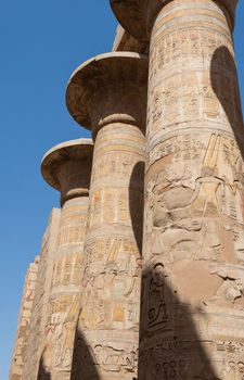 Hieroglypic carvings on columns at the ancient egyptian Karnak Temple in Luxor Egypt
