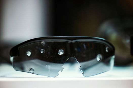 Safety goggles. Ballistic protective eyewear with plastic sunglasses. Protective ballistic goggles after testing. Protective sunglasses saved your eyes