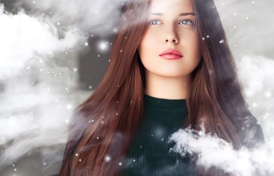 Winter beauty, Christmas time and happy holidays, beautiful woman with long hairstyle and natural make-up behind frozen window, snowing snow design as xmas, New Year and holiday lifestyle portrait style