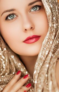 Beauty, luxury fashion and glamour, woman dressed in gold, portrait