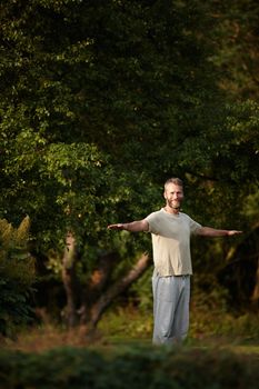 Yoga is a way of life. Portrait of a handsome mature man enjoying a yoga session in nature
