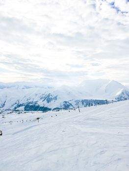 View of snowcapped mountains. Ski resort. Winter sport. Snowy mountains of Gudauri Georgia
