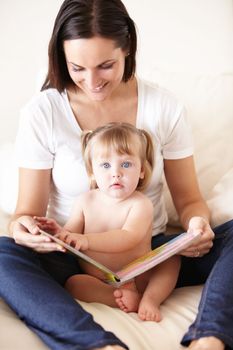 I like this picture. A cute little girl reading with her mother