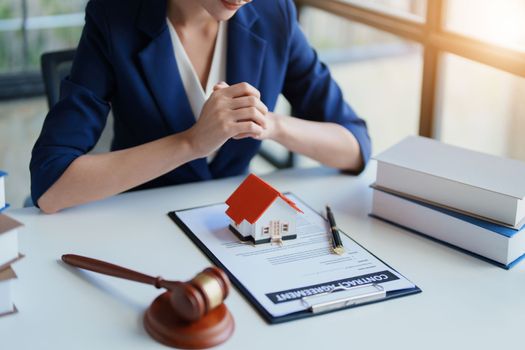 Law, Consultation, Agreement, Contract, Concept Attorney or Lawyer is sitting and accepting complaints from clients for home and land matters in court