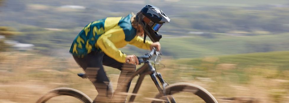 Bike, fitness and man cycling with speed on a sports bicycle for cardio exercise, workout and training for a race. Action, biker and healthy athlete riding fast in nature outdoors in summer in Texas.