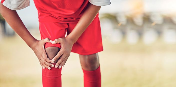 Sport, knee injury and soccer player on field, fitness and athlete have pain with exercise and medical emergency. Soccer, accident in game and sports training, muscle ache and active lifestyle