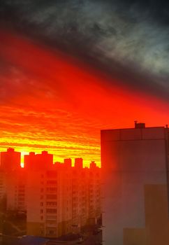 Colorful suburban sunset over residential buildings close-up